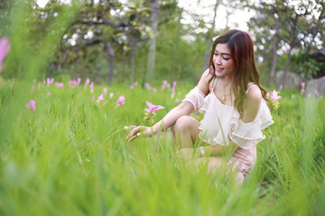 Fototapeta premium pretty asian woman in siam tulip flower field