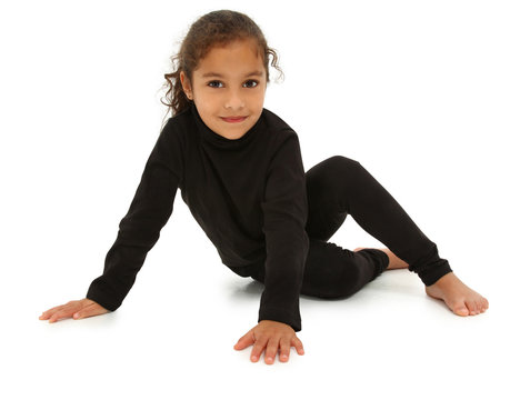 Beautiful Hispanic Preschooler barefoot on white floor with clip