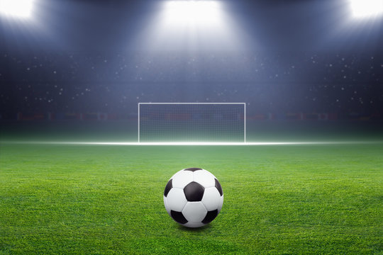 Soccer ball, goal, spotlight
