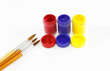 Watercolors and brushes isolated on white background