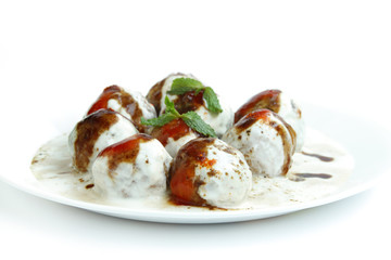 Tasty banana dahi vada kept in a plate