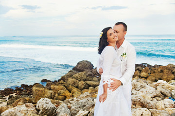 couple on the beach on their wedding day