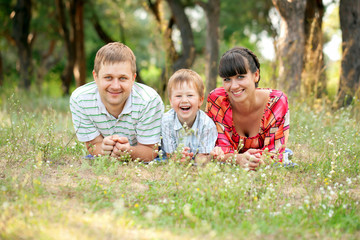 Fototapeta premium Happy family outdoors. Summer holiday.