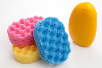 bottle of shower gel and sponges