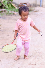 baby girl playing with racket