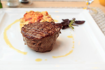 Steak with gratin on a plate
