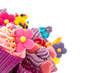 Purple and pink cupcakes in corner