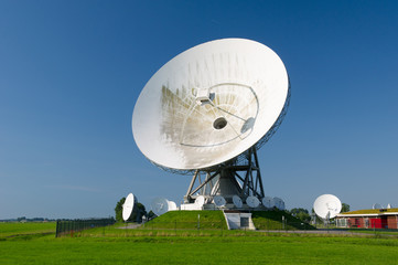 Satellite dishes in landscape