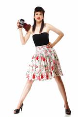 Pretty retro girl with vintage camera