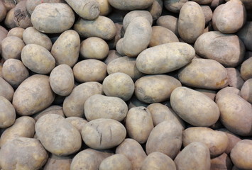 potatoes in market as background