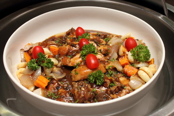 Chicken pieces stewed with vegetables