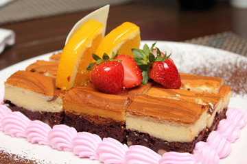 brownie cheese cake decorated with fruit