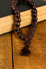 the Wooden rosary beads and holy bible