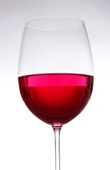 Fotobehang Glass of wine close-up © Africa Studio