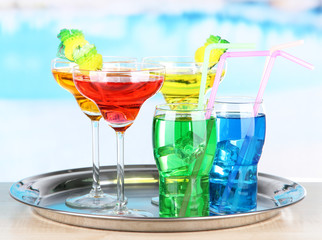 Different  colorful cocktails on bright background