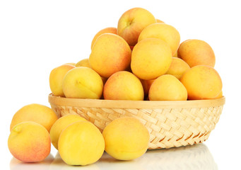 Fresh natural apricot in wicker basket isolated on white
