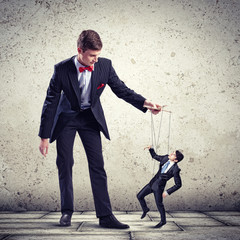 Businessman puppeteer