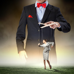 Businessman puppeteer
