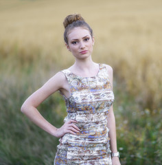 Beautiful woman in the wheat field