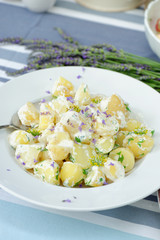 Potato salad with mayonnaise, lavender and spring onion