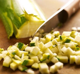 cutting zucchini in cubes