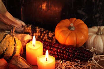 Fototapeta na wymiar Arrangement of pumpkins, candles and autumn decorations