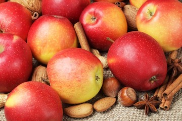 Apples, cinnamon sticks, nuts and anise.