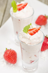 Eton Mess Shots - Strawberries with whipped cream and meringue.