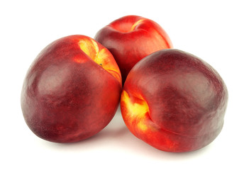 Ripe peaches isolated on white background