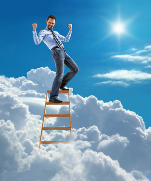 businessman standing at the top of ladder high in the sky