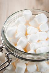 Fototapeta na wymiar Glass jar with marshmallows