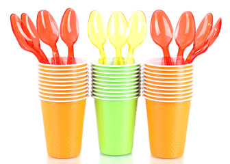 Cups and spoons in different color isolated on white
