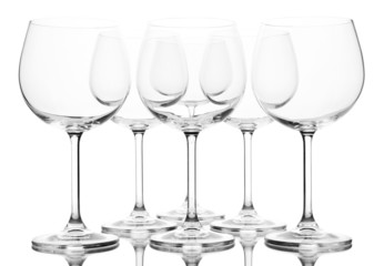 Empty wine glasses arranged and isolated on white