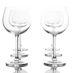 Empty wine glasses arranged and isolated on white