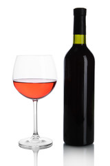 Red wine glass and bottle of wine isolated on white