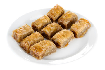 Sweet baklava on plate isolated on white