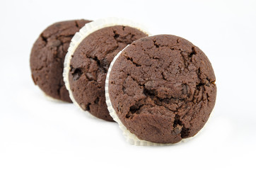 Chocolate muffins isolated on white