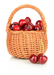 Fototapeta na wymiar Cherry berries in wicker basket isolated on white