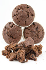 Group of chocolate muffins and crumbs- Isolated on white