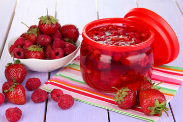 Home made berry jam on wooden table