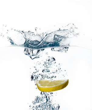 Healthy Water with Lemon. Splashing