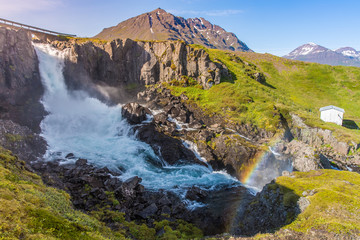 Fototapeta na wymiar Small Waterfall at Seyðisfjörður, East-Fjords, Iceland