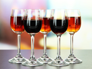 Glasses of liquors, on bright background