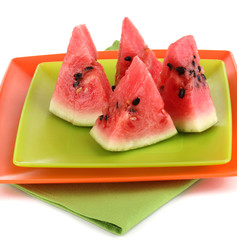 Sweet watermelon slices on plates isolated on white