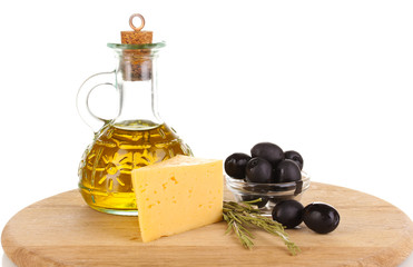 Black olives in white bowl with rosemary,olive oil and cheese