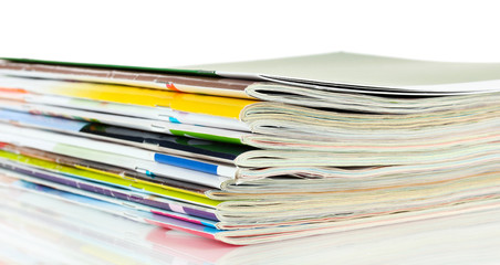 Many magazines isolated on white