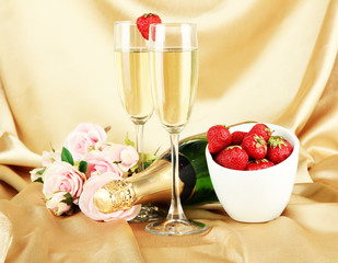 Romantic still life with champagne, strawberry and pink roses,