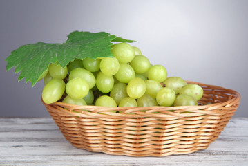 Ripe delicious grapes in wicker basket