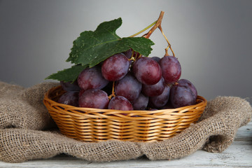 Ripe delicious grapes in wicker basket