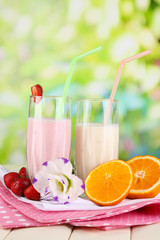 Delicious milk shakes with strawberries and orange